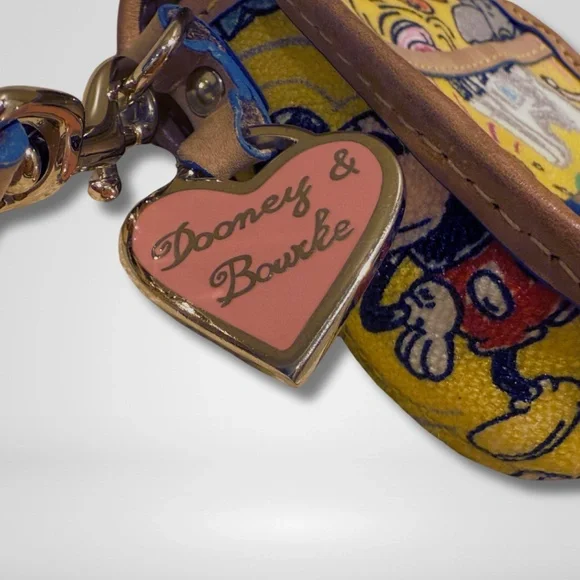 Disney Parks Dooney & Bourke Yellow Sketch Wristlet Disney World Disneyland Clutches & Wristlets
